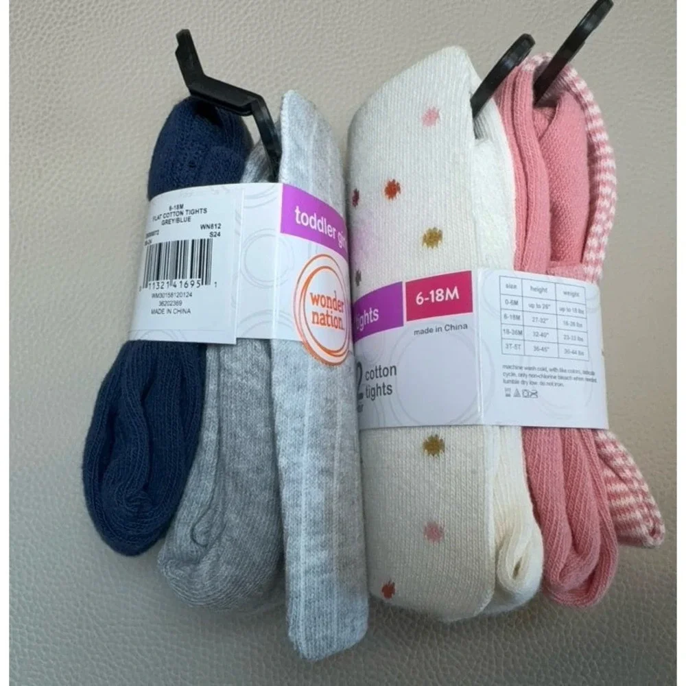 Four pairs of toddler girls cotton tights size 6-18 months.